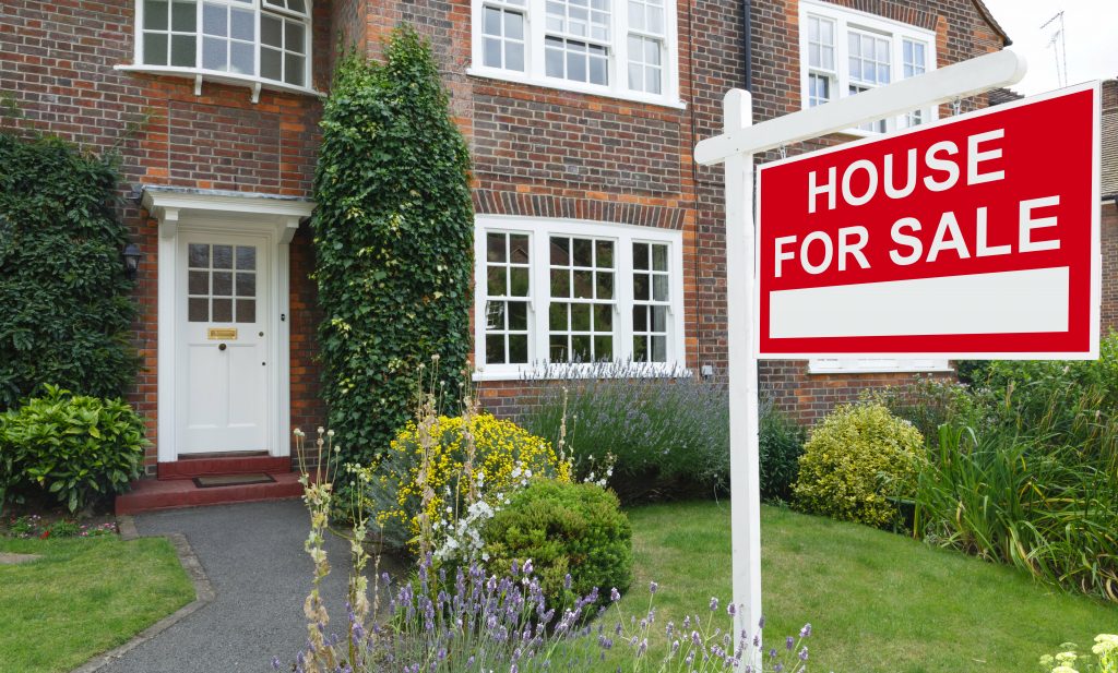 Attractive property has a house for sale sign in front garden, to sell your house fast contact Derby's local experts, Cash Property Buyer